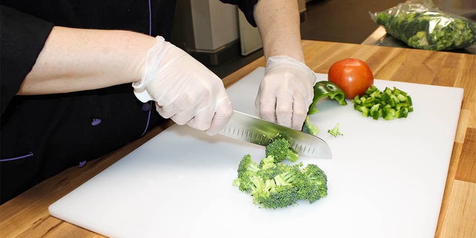 Cook chopping vegetables