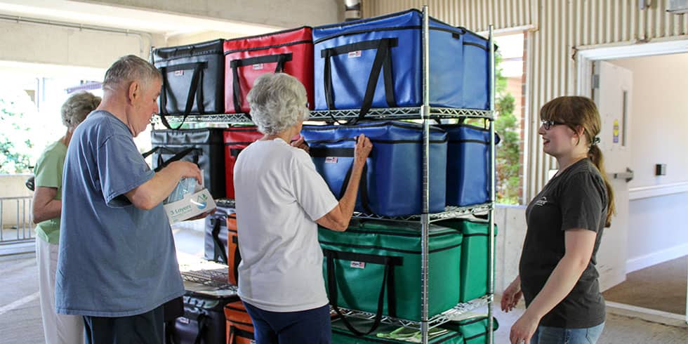 Volunteer delivering meals 