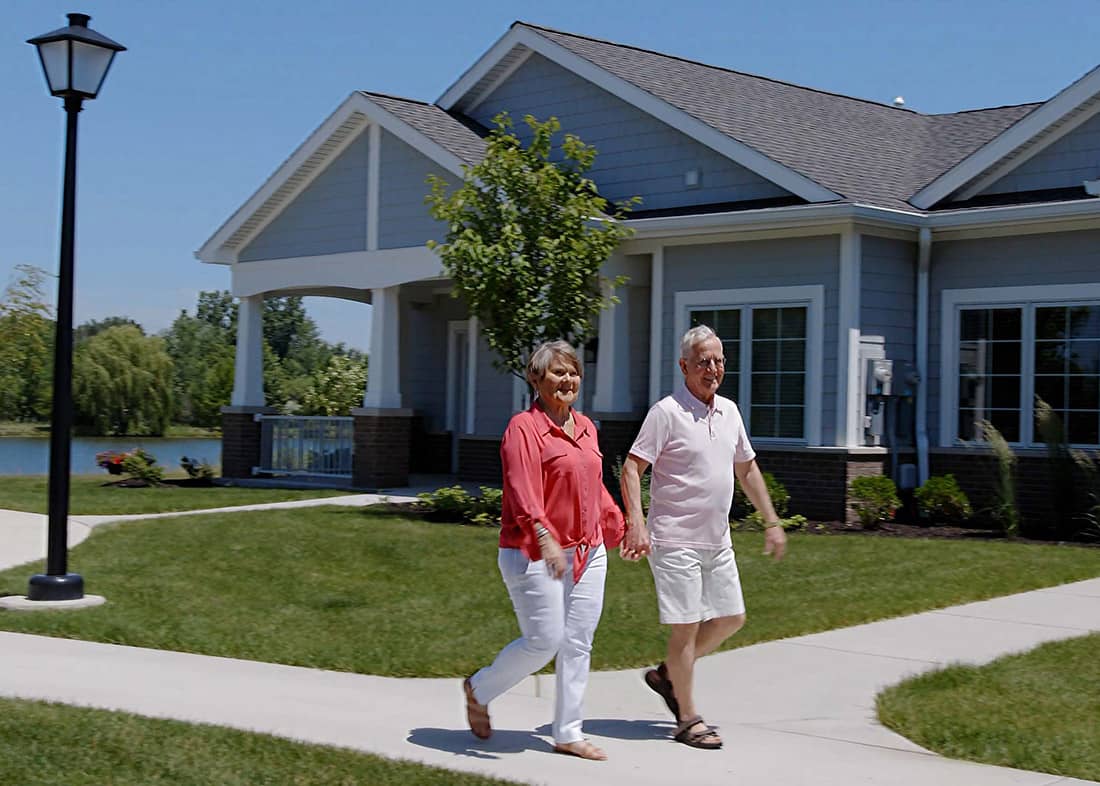 Elderly couple walking through the Cove neighborhood